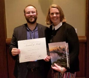 Dr. Nic Hartman and Jan Stoffer holding their award